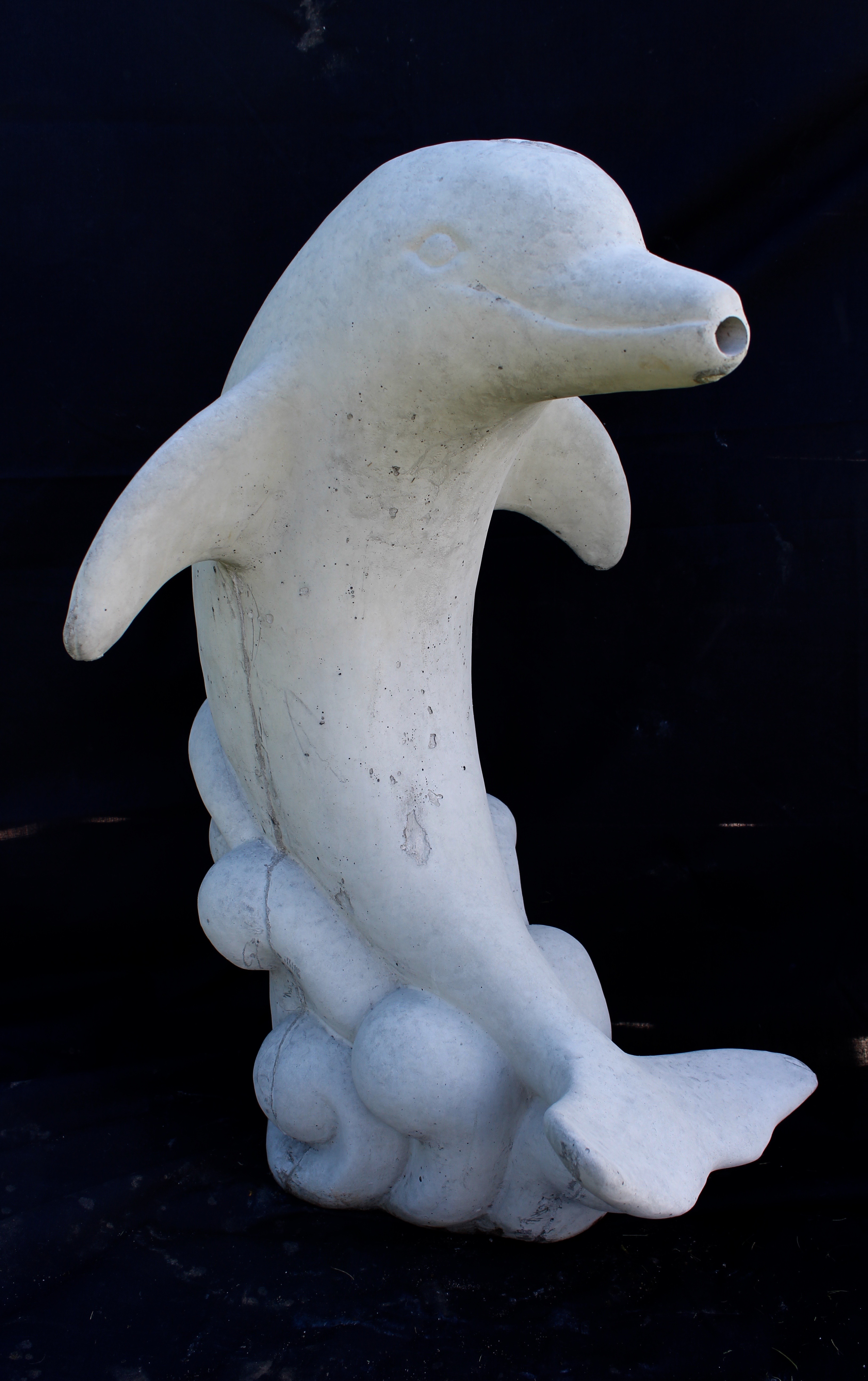 outdoor concrete dolphin statues