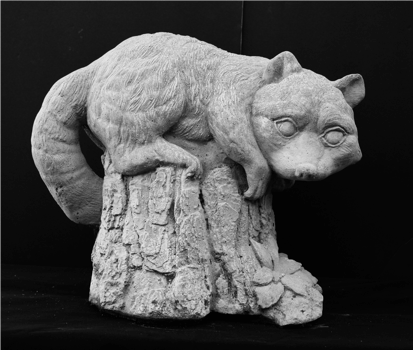 concrete raccoon garden statue